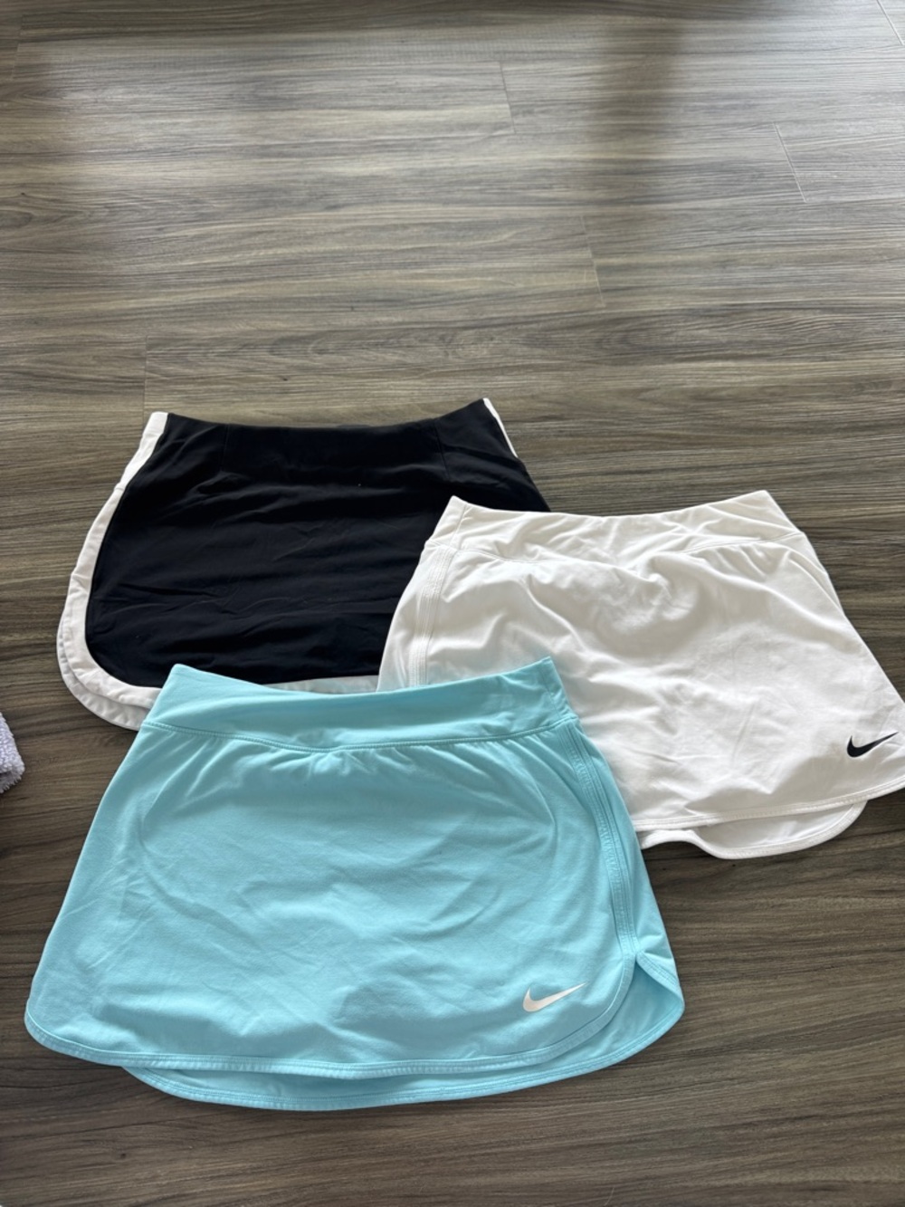 Nike Girls' Athletic Skorts in Black, White, and Light Blue